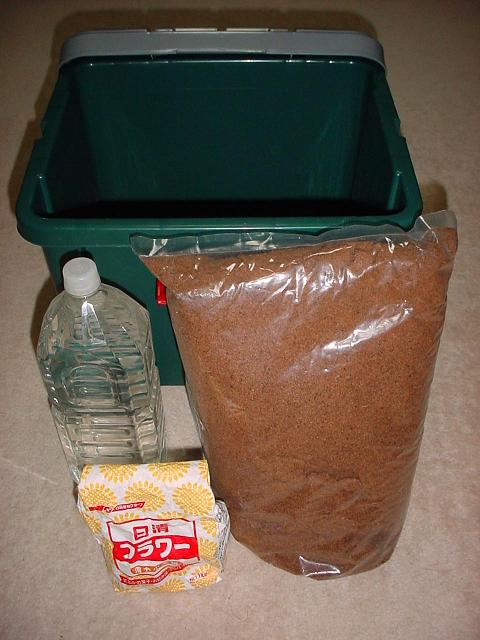  Figure 4  A container, a bottle of natural water, wheat flour and wood mulch